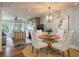 Charming dining room with a glass-top table and white chairs at 4426 Sea Forest Dr, Kiawah Island, SC 29455