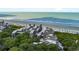 Aerial view of beachfront community with ocean and homes at 4426 Sea Forest Dr, Kiawah Island, SC 29455