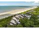 Aerial view of beachfront community with ocean and homes at 4426 Sea Forest Dr, Kiawah Island, SC 29455