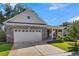 Two-car garage with a brick exterior and a concrete driveway at 100 Lilith Ln, Summerville, SC 29485