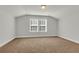 Spacious bedroom with neutral carpeting and large window at 100 Lilith Ln, Summerville, SC 29485