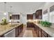 Spacious kitchen featuring granite countertops and dark wood cabinets at 100 Lilith Ln, Summerville, SC 29485