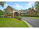 Brick community clubhouse with a covered entryway and landscaping at 100 Lilith Ln, Summerville, SC 29485