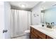 Simple bathroom with white shower curtain and wood vanity at 1721 Live Oak Park, Seabrook Island, SC 29455