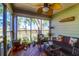 Sunroom with wicker furniture and marsh views at 1721 Live Oak Park, Seabrook Island, SC 29455