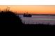 Scenic sunset view over the water with a fishing boat at 1721 Live Oak Park, Seabrook Island, SC 29455