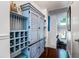 Hallway with blue painted cabinet and wine rack at 1721 Live Oak Park, Seabrook Island, SC 29455