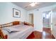 Small bedroom with daybed, light blue walls, and hardwood floor at 1721 Live Oak Park, Seabrook Island, SC 29455
