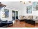 Living room with hardwood floors, fireplace and access to deck at 1721 Live Oak Park, Seabrook Island, SC 29455