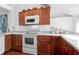 Updated kitchen, white appliances, wood cabinets, and granite counters at 1721 Live Oak Park, Seabrook Island, SC 29455