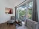 Cozy sitting area with two armchairs and a side table, featuring a large window with scenic view at 2221 Oyster Catcher Ct, Seabrook Island, SC 29455