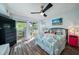 Main bedroom with king-size bed and access to private deck at 2221 Oyster Catcher Ct, Seabrook Island, SC 29455