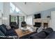 Living room with fireplace, large sectional sofa, and high ceilings at 2221 Oyster Catcher Ct, Seabrook Island, SC 29455