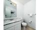 Clean bathroom with marble vanity, toilet, and towel rack at 2221 Oyster Catcher Ct, Seabrook Island, SC 29455