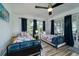 Bedroom with two twin beds and access to private deck at 2221 Oyster Catcher Ct, Seabrook Island, SC 29455