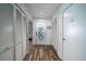 Bright entryway with built-in storage and wood-look floors at 2221 Oyster Catcher Ct, Seabrook Island, SC 29455