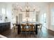 Bright dining room with farmhouse table and chandelier at 532 Hayes Park Blvd # 5, Johns Island, SC 29455