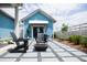 Relaxing patio with fire pit, seating, and a blue cottage at 532 Hayes Park Blvd # 5, Johns Island, SC 29455