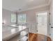 Upstairs hallway with built-in shelving and hardwood floors at 143 Island Park Dr, Charleston, SC 29492