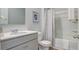 Clean bathroom with a single vanity, tub shower combo, and updated flooring at 3101 Dalmore Dr, Ravenel, SC 29470