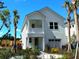 Two-story white house with a balcony and palm trees at 237 Claret Cup Way, Charleston, SC 29414