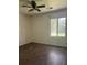 Simple bedroom with dark laminate flooring and a window overlooking the backyard at 106 Teddy Ct, Summerville, SC 29485