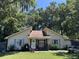 Cute yellow house with blue shutters and a well-maintained lawn at 106 Teddy Ct, Summerville, SC 29485