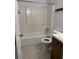 Clean bathroom with a tub, toilet and wood vanity at 106 Teddy Ct, Summerville, SC 29485