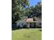 Cute yellow house with blue shutters and a well-maintained lawn at 106 Teddy Ct, Summerville, SC 29485