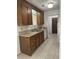Kitchen with wood cabinets, white appliances, and tile floor at 106 Teddy Ct, Summerville, SC 29485
