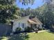 Cute yellow house with blue shutters and a well-maintained lawn at 106 Teddy Ct, Summerville, SC 29485