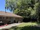 Brick home with back patio, large trees, and storage shed at 106 Teddy Ct, Summerville, SC 29485