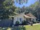 Cute yellow house with blue shutters and a well-maintained lawn at 106 Teddy Ct, Summerville, SC 29485