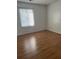 Light and bright bedroom featuring wood laminate flooring and a window with blinds at 106 Teddy Ct, Summerville, SC 29485