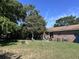 Spacious backyard with fire pit and mature trees at 1219 Oakcrest Dr, Charleston, SC 29412