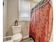Bathroom with toilet, shower, and patterned shower curtain at 2832 Ranger Dr, North Charleston, SC 29405