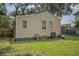 Rear view of tan house, showing yard and storage at 2832 Ranger Dr, North Charleston, SC 29405