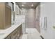 Modern bathroom featuring a walk-in shower with tile surround and double vanity at 191 Harbour Watch Way, Mount Pleasant, SC 29464