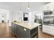 Modern kitchen with gray island, white cabinets, and stainless steel appliances at 191 Harbour Watch Way, Mount Pleasant, SC 29464