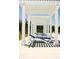 Relaxing poolside lounge area with white pergola and blue loungers at 508 Eagleview Dr, Moncks Corner, SC 29461