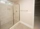 Modern bathroom with a large glass shower and neutral tile at 508 Eagleview Dr, Moncks Corner, SC 29461