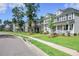 Row of charming two-story homes with green lawns and tree-lined street at 508 Eagleview Dr, Moncks Corner, SC 29461