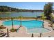 Resort-style pool with plenty of lounge chairs and lake views at 3850 Delinger Dr, Mount Pleasant, SC 29466