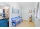 Inviting entryway with blue bench and access to home gym at 1426 Sc-45, McClellanville, SC 29458