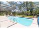 Inviting screened pool with surrounding greenery at 1426 Sc-45, McClellanville, SC 29458