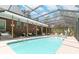 Relaxing screened pool area with brick patio at 1426 Sc-45, McClellanville, SC 29458