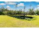 Serene pond with lush green grass at 1426 Sc-45, McClellanville, SC 29458