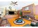 Living room with hardwood floors, brick fireplace, and built-in shelving at 1426 Sc-45, McClellanville, SC 29458