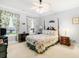 Bright bedroom with floral bedding and a charming wood bed frame at 1426 Sc-45, McClellanville, SC 29458