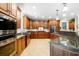 Spacious kitchen with granite countertops, stainless steel appliances, and ample cabinetry at 1426 Sc-45, McClellanville, SC 29458